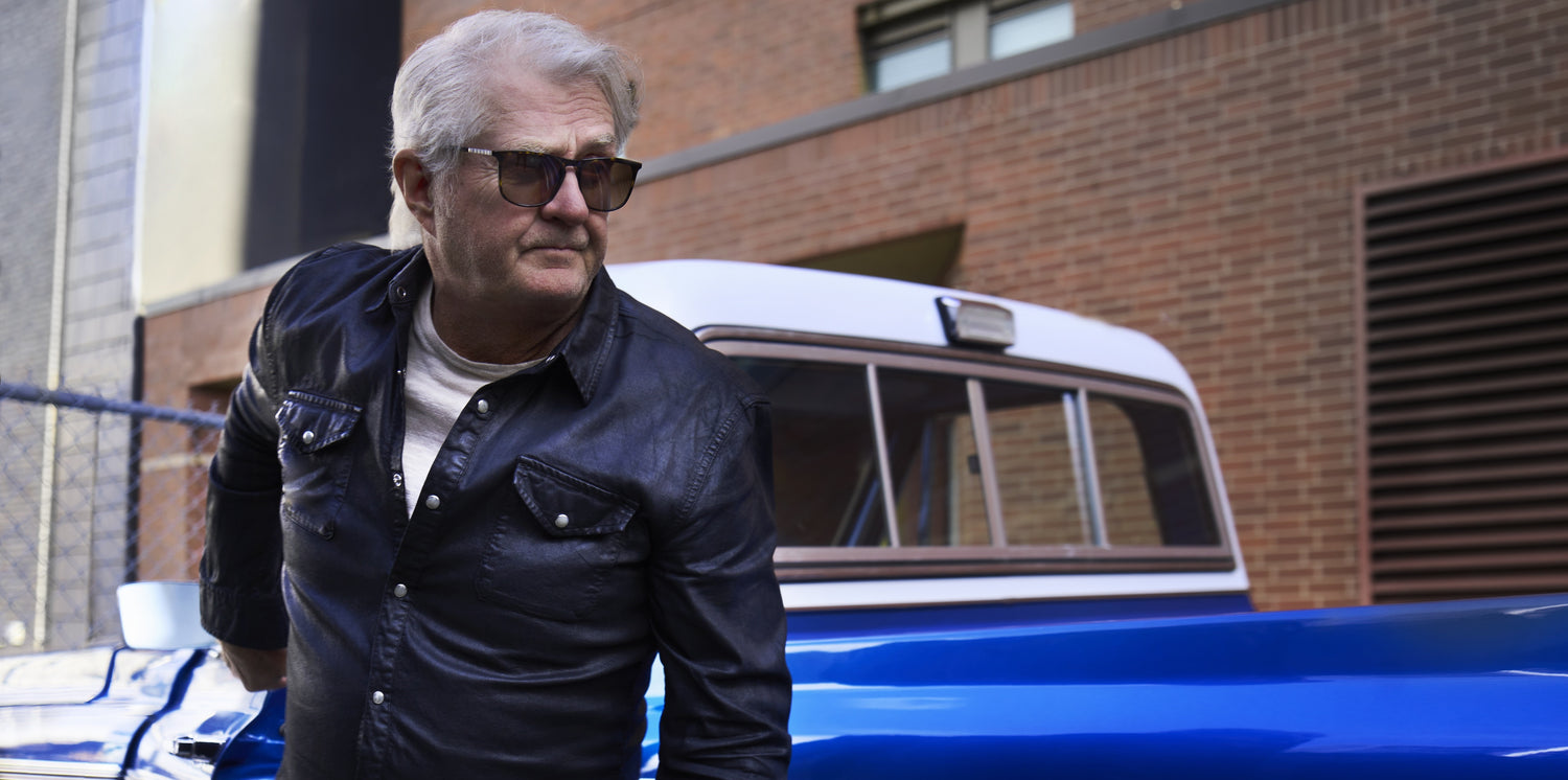 Tom Sacori standing with the Eyeglasses brand 1
