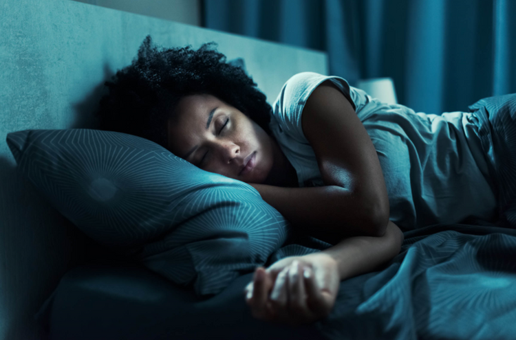 A lady sleeping with eyes closed